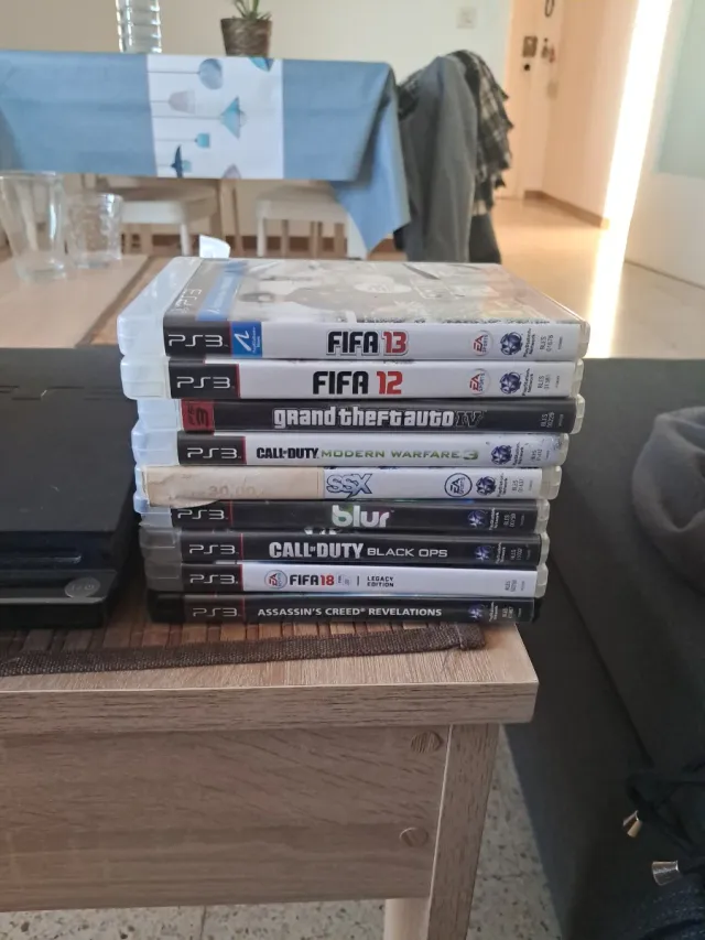 PlayStation 3 + Mando + 9 Juegos