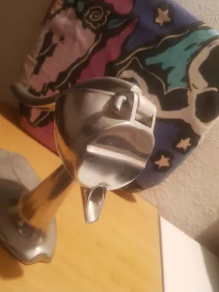 Antico grande spremiagrumi metallico