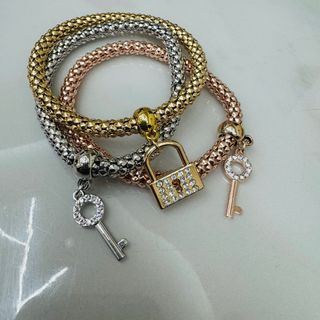 3 bracciali set bigiotteria oro, argento, rosa