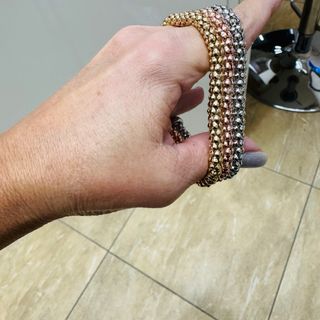 3 bracciali set bigiotteria oro, argento, rosa