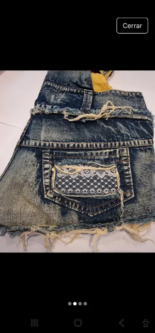 Peto corto vaquero desgastado