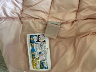 Chaqueta de plumas iridiscente