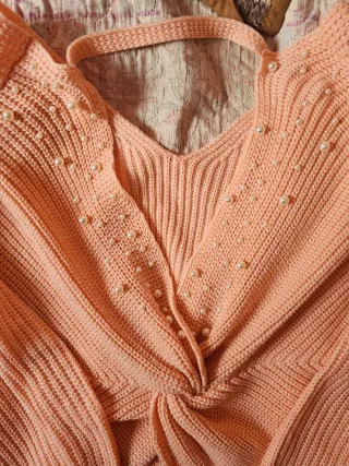 Jersey de lana rosa con espalda abierta