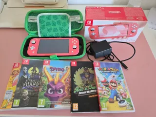 Nintendo Switch Lite Coral + Custodia + 7 Giochi