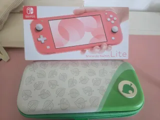 Nintendo Switch Lite Coral + Custodia + 7 Giochi