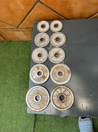 Barra olímpica y pesas para gimnasio