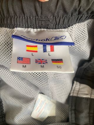 Pantalón chándal Reebok gris y naranja