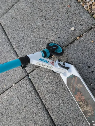 Patín Oxelo blanco y azul