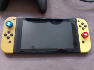 Nintendo Switch Edición Pokémon Eevee+ 2 Mandos