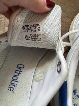 White and blue Adidas Stan Smith lace up sneakers