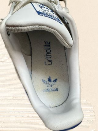White and blue Adidas Stan Smith lace up sneakers