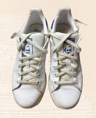 White and blue Adidas Stan Smith lace up sneakers