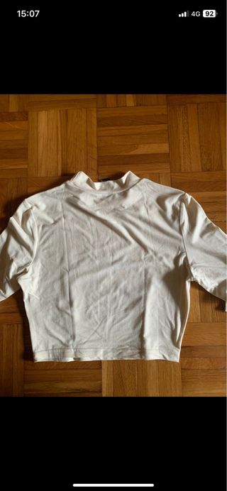 Top crema manga larga estampado ojo