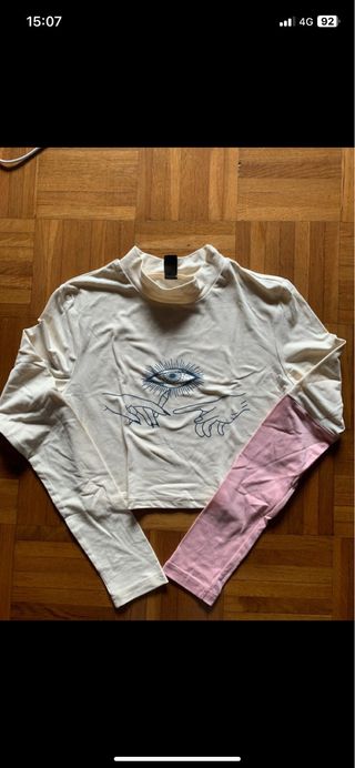 Top crema manga larga estampado ojo