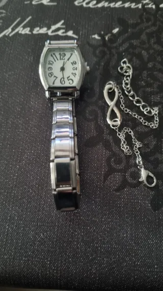 Reloj de acero con pulsera de regalo