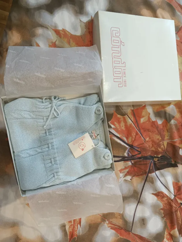 Saco bebé Condor azul tejido.