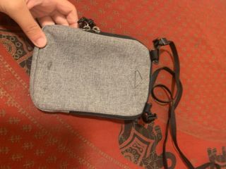 Bandolera Eastpak gris