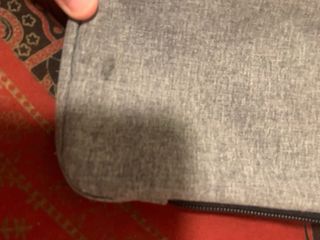 Bandolera Eastpak gris