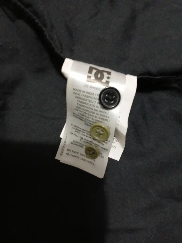 Camisa DC bicolor verde y negra