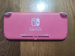 Nintendo Switch Lite Rosa + Caricatore + fodera