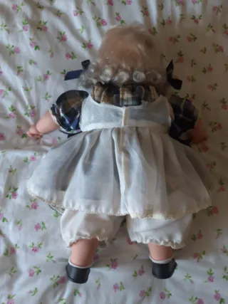 Muñeca que ríe y dice mamá