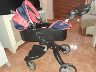 Carro de muñecas rosa y azul