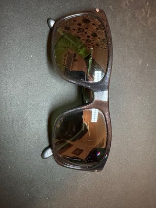 Gafas de sol Persol Negras cristal verdoso.