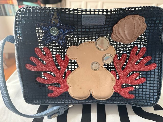 Bandolera Tous azul y roja con apliques