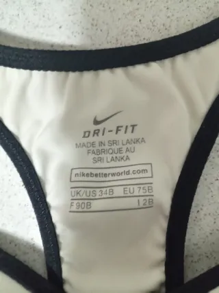 Top deportivo Nike blanco y azul
