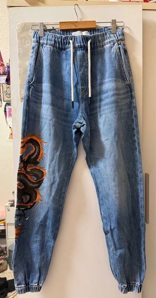 Pantalones vaqueros unisex con dragón