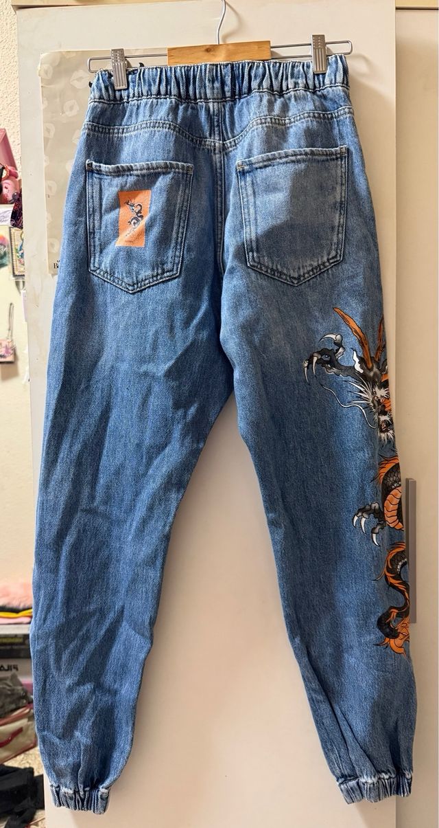 Pantalones vaqueros unisex con dragón