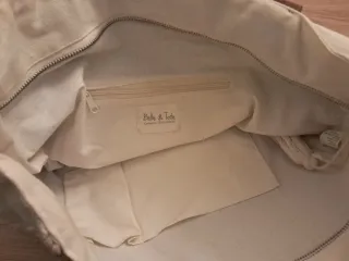 Bolso de mano con flecos y bordados