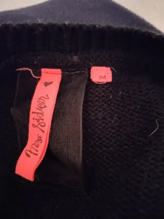 Jersey mujer negro y gris con flecos