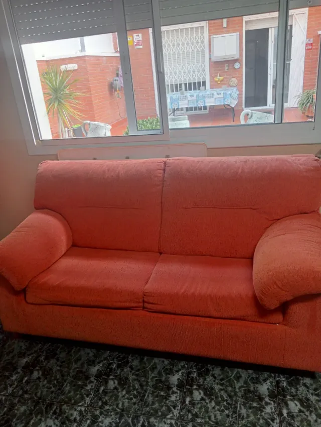 Divano letto arancione in tessuto