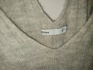 Jersey gris con espalda cruzada