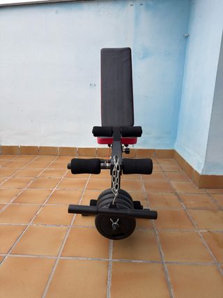 Banco de pesas con discos y pesas