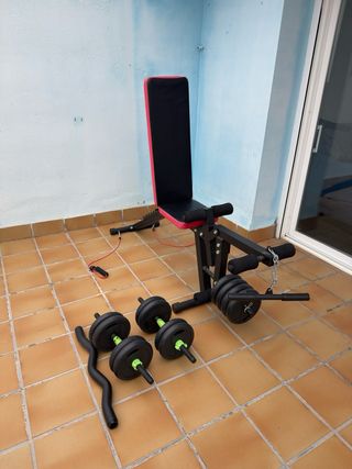 Banco de pesas con discos y pesas