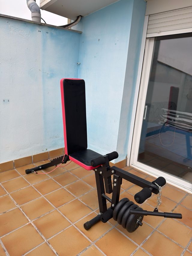 Banco de pesas con discos y pesas