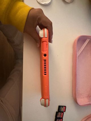 Nintendo Switch Lite Rosa + Custodia + 5 Giochi