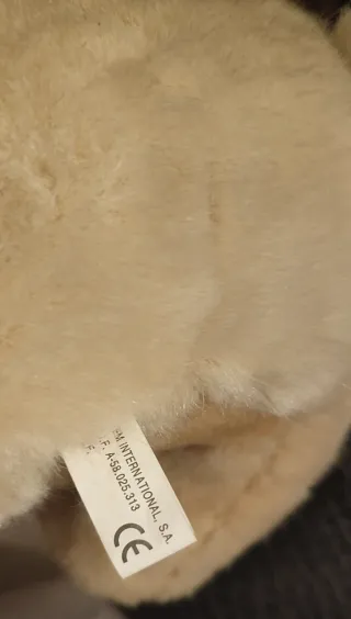 Urso de peluche com laço xadrez