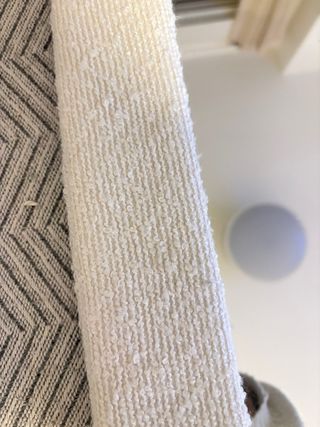 Espejo ovalado con marco de tela