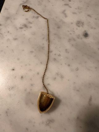 Péndulo radiestesia dorado con cadena