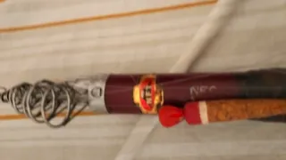 Caña (8) de pescar antigua con carrete