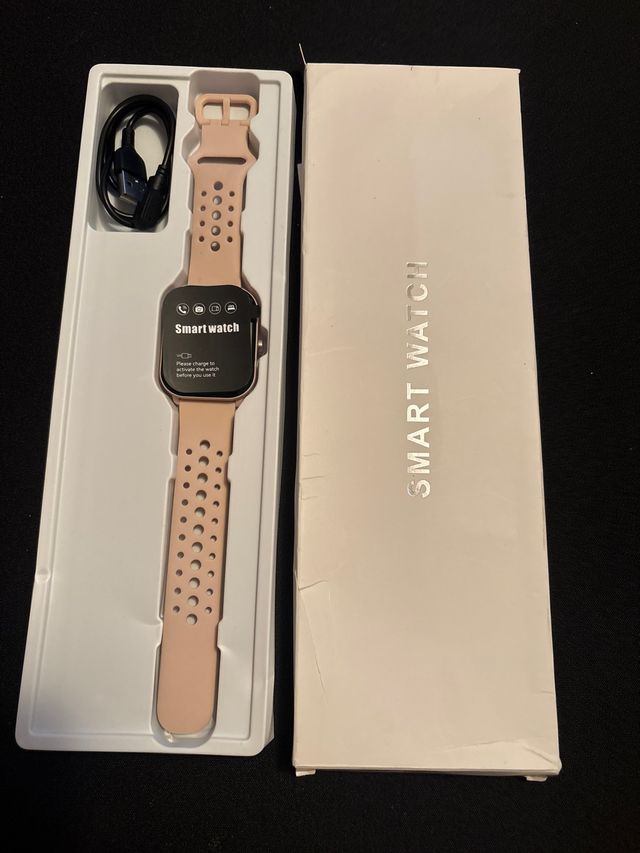 Smartwatch rosa con cargador
