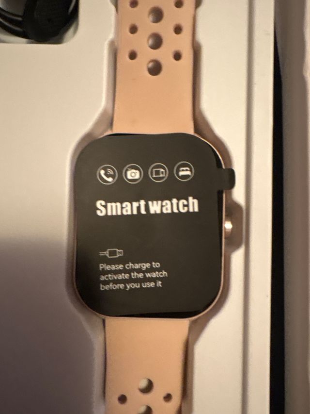 Smartwatch rosa con cargador