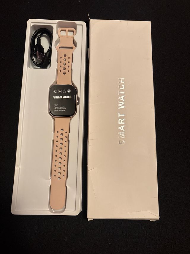Smartwatch rosa con cargador