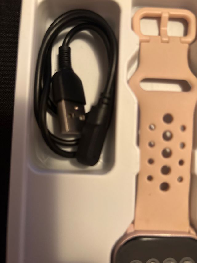 Smartwatch rosa con cargador