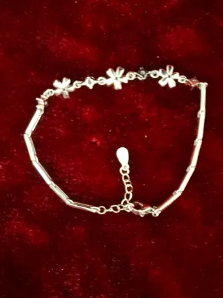 Pulsera plata con flores y circonitas