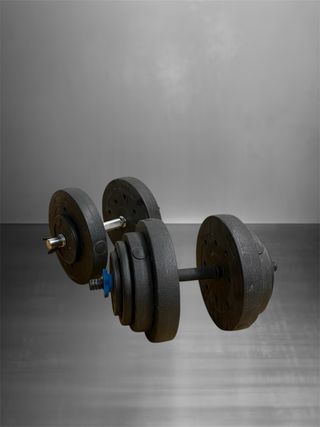 Panca multifunzione per palestra + dischi + manubri.