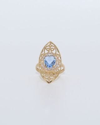 LANZADERA PEQUEÑA PIEDRA AZUL Y CIRCONITAS 18K